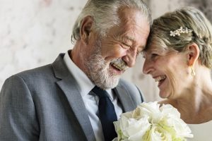 Senior Couple with White Roses Flower Bouqet Senior Couple with White Roses Flower Bouqet